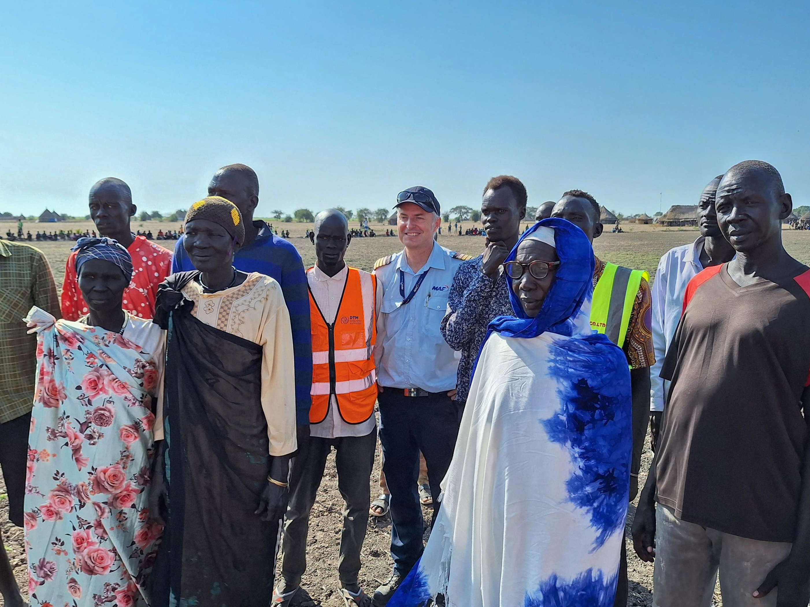 Torpuot Villagers gather at the airstrip - Jono Pound