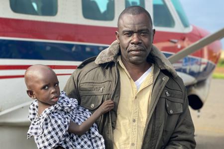 Boniface and Ojiya prepare to travel with MAF